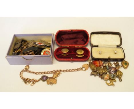 A cased pair of 18ct pearl shirt studs; together with a charm bracelet; a small quantity of metal trinkets and charms; anothe