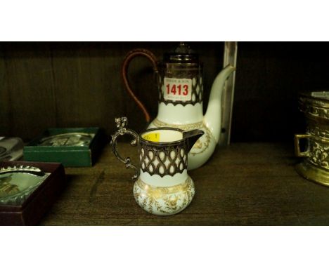 A Victorian Royal Worcester silver mounted bachelor's coffee pot and cream jug, circa 1893.