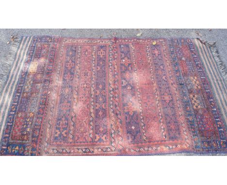 A Caucasian rug having lines of geometric patterns, (possibly a saddle bag) 197 x 122cm.