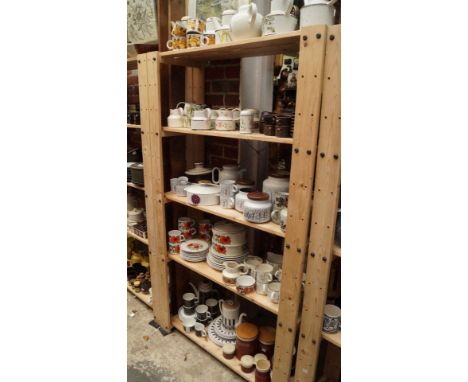 A large quantity of Midwinter, Hornsea, Meakin and Susie Cooper pottery, (five shelves). 