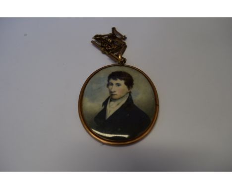 English School, early 19th century, portrait miniature of a young gentleman, on ivory, in yellow metal frame having glass bac