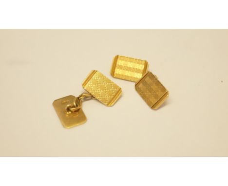 A pair of 18ct gold engine turned rectangular cufflinks, 7.8g. Condition Report: In good order with minor surface scratching.