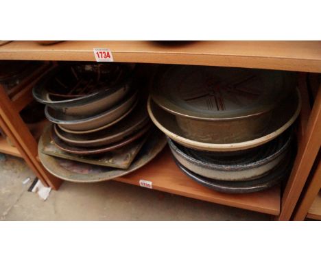 Studio Pottery: a small quantity of bowls and chargers, (one shelf). 