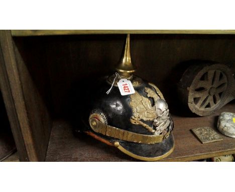 A pickelhaub helmet. Condition Report: We do not believe this has any great age.