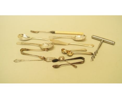 A silver pickle fork having ivory handle; together with two silver preserve spoons; two pairs of silver sugar tongs; a silver