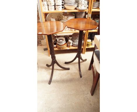 A pair of old mahogany octagonal tripod tables, each with a spiral reeded column, 38cm wide.