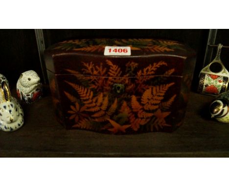 An Edwardian fern ware tea caddy with serpentine front, stamped 'Smith, Mauchlin, Manuafacturers His Majesty', 20.5cm wide.  