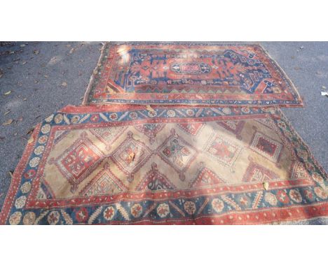 A Hamadan geometric rug and a similar example with five central medallions.