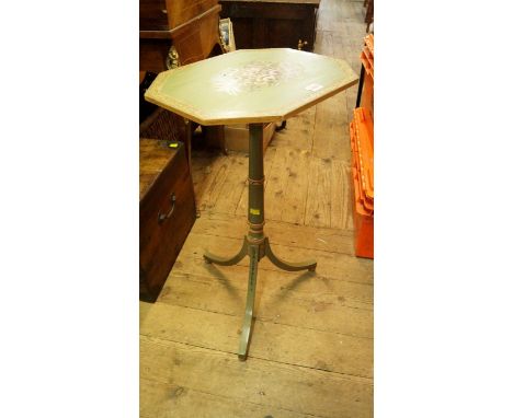 An antique green painted octagonal tripod occasional table, with rising and fall tilt top, 41cm wide.
