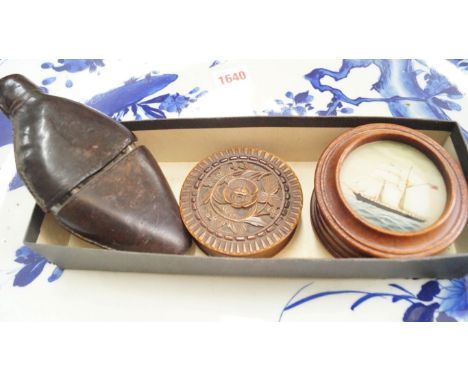 A late 19th/early 20th century leather cased hip flask; together with a carved wood snuff box and cover; and another wood box