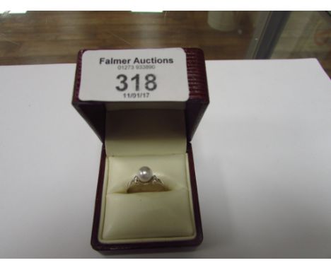 Silver and pearl ring