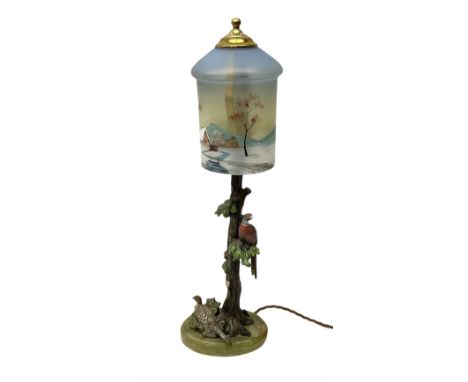 20th century cold painted bronze lamp, modelled in the form of a tree surmounted by two pheasants, with painted glass shade, 