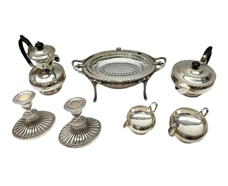 Collection of silver plate to include pair of Falstaff dwarf candlesticks in the 'Adam' style, weighted and raised upon flute