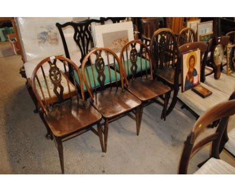 Three Ercol stick back dining chairs and two stick and wheelback dining chairs 