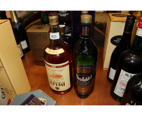 A 1.5L bottle of Bells Extra Special old scotch whisky; and a bottle of Special Old Reserve single malt Glenfiddich pure malt