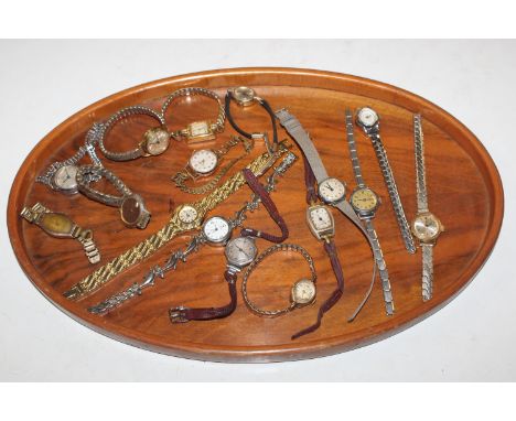 A wooden tray and a collection of vintage ladies wrist watches to include Omar, rolled gold and Timex
