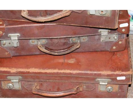 EIGHT VINTAGE SUITCASES