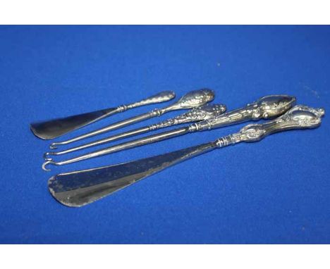 THREE SILVER HANDLED BUTTON HOOKS AND TWO SILVER HANDLED SHOE HORNS 