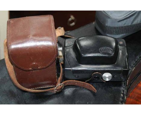 THREE VINTAGE CAMERAS
all in cases and a banjo