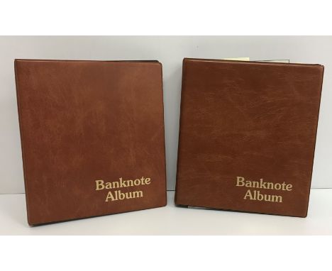 Two bank note albums containing 262 various World and GB bank notes including a Bank of England £5 dated September 5 1949 sig