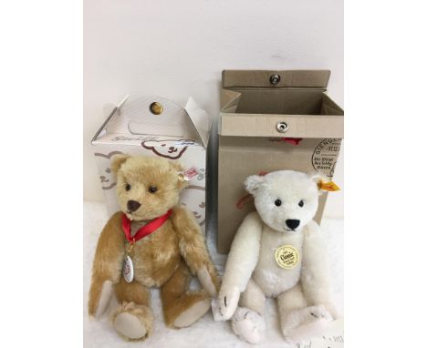 A Steiff 2002 Anniversary teddy bear No.'d 7140 bearing "100 years of Steiff Teddy Bears" keyring/marker on red ribbon togeth