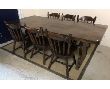 A 20th Century oak refectory style dining table, the single piece top on end trestle supports, 212 cm long x 97 cm wide x 76 