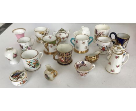 A collection of minutre cups, vases etc to include Minton, Royal Worcester, Coalport etc