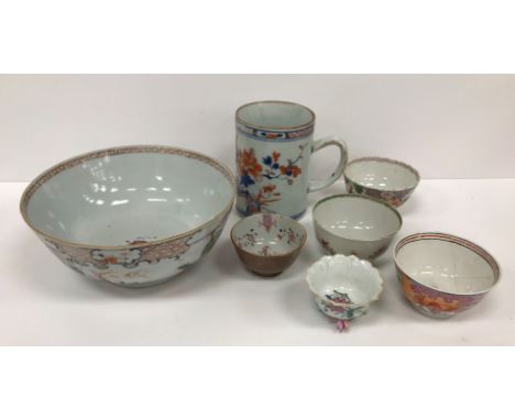 A collection of Oriental wares to include Imari palette mug, famille rose bowl, various tea bowls, ginger jar, Chinese export