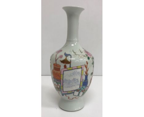 A Chinese baluster shaped vase, the decoration depicting various vases, screens etc, raised on a circular base 30 cm high CON