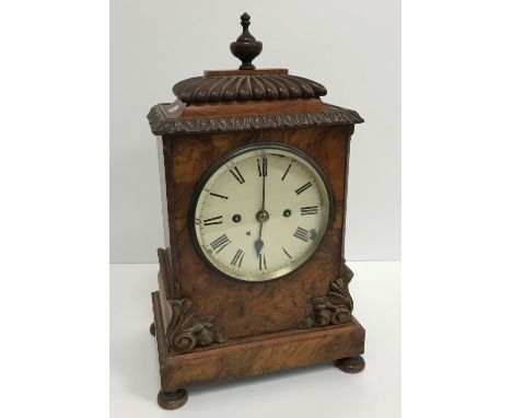 A Victorian burr walnut veneered mantel clock, the eight day movement with circular painted dial and Roman numerals, housed i