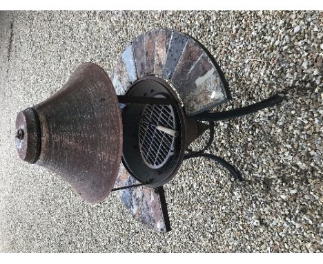 A barbecue in the form of a wishing well, a pair of composite stone circular garden urns and a pair of composite stone rectan