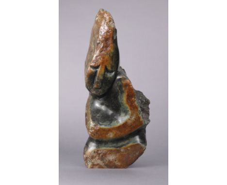 A 20th century African carved stone large figural sculpture signed “G. ZHUYEKA” to base, 51cm high.