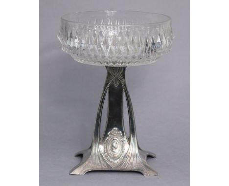 A WMF silver-plated Art Nouveau comport, the square tapered base with stylised leaf fronds supporting a glass dish, 26cm high