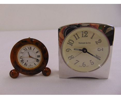 A Nepro faux tortoiseshell travel clock and a Tiffany bedside clock with Arabic numerals