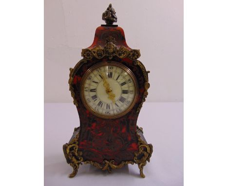 A Boule work mantle clock of customary form, with white enamel dial and Roman numerals