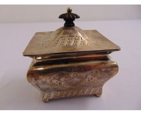 A Victorian silver tea caddy of casket form, chased with flowers and leaves with domed hinged cover, Birmingham 1892