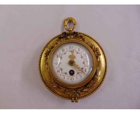A French ormolu wall clock, circular with white enamel dial and Arabic numerals