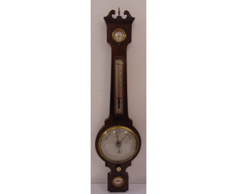 An Edwardian mahogany wall barometer and thermometer with swan neck pediment and brass finial