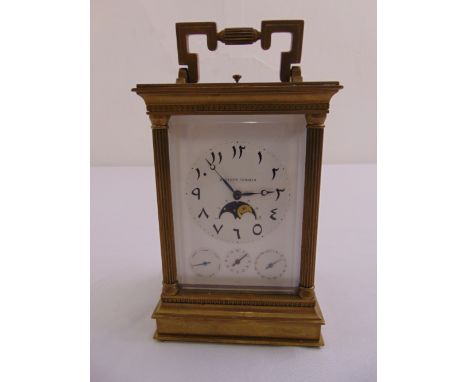 A Mathew Norman brass repeating carriage clock with Arabic numerals, phases of the moon and three subsidiary dials