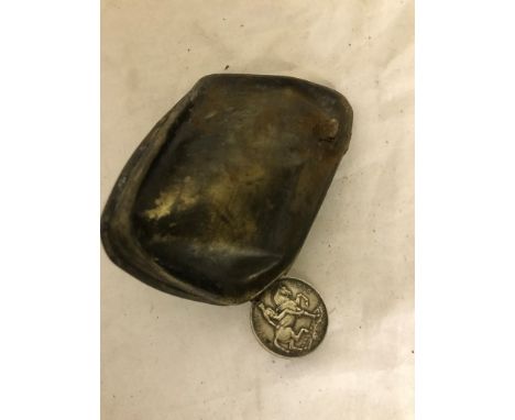 A WWI 1914 Queen Mary tin lid with bullet lodged in it; together with a soldiers WWI medal: Manchester Regiment 8846 Private 