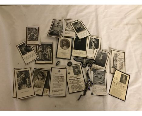 A collection of WWII German death cards, Mother's Cross patch and two badges