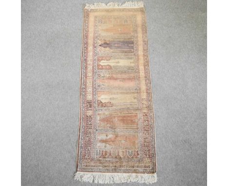 A Persian runner, with a central row of medallions, within multiple borders224 x 86cm