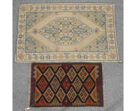 An Afghan kelim rug, 95 x 57cm, together with a hand stitched panel, 140 x 90cm (2)