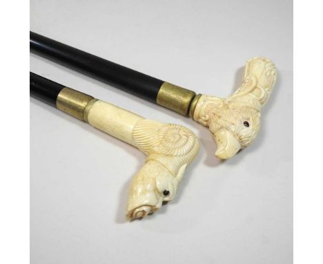 A novelty carved bone handled walking stick, 20th century, together with another (2)90cm longCondition report: Modern. Condit