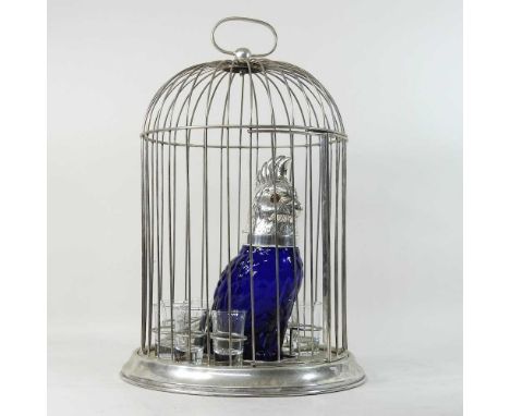 A modern claret jug, in the form of a blue glass and plated parrot, contained in a plated cage, with shot glasses45cm highCon