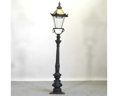 A Victorian style metal garden lantern, on lamp post192cm high overall