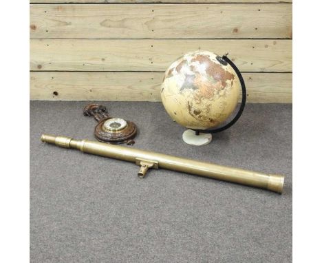 A modern globe, on an onyx base, 28cm diameter, together with a brass part telescope, an aneroid barometer and Colin Giles, N