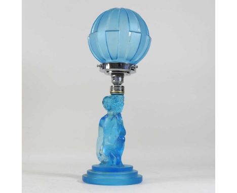 An Art Deco pressed blue glass table lamp and shade, circa 1930, with a figural support and chrome mounts with a globe shade4