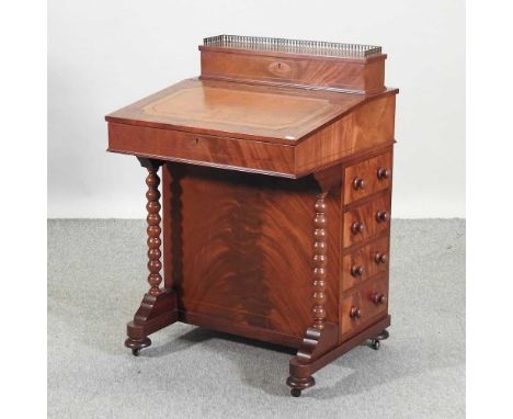 A reproduction Victorian style mahogany davenport, with bobbin turned supports61w x 57d x 89h cm