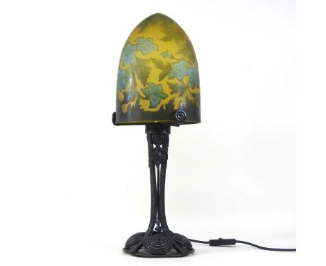 An iron table lamp, with a cameo glass shade, in the style of Galle56cm high